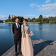A photo taken of the couple by the lake.